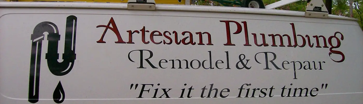 The side of an Artesian Plumbing van in 2009, lettered Remodel and Repair, Fix it the first time